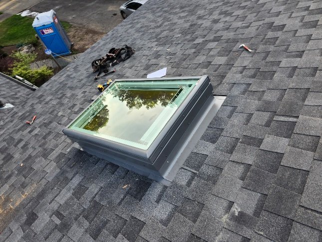Skylight on new roof during installation, Portland OR